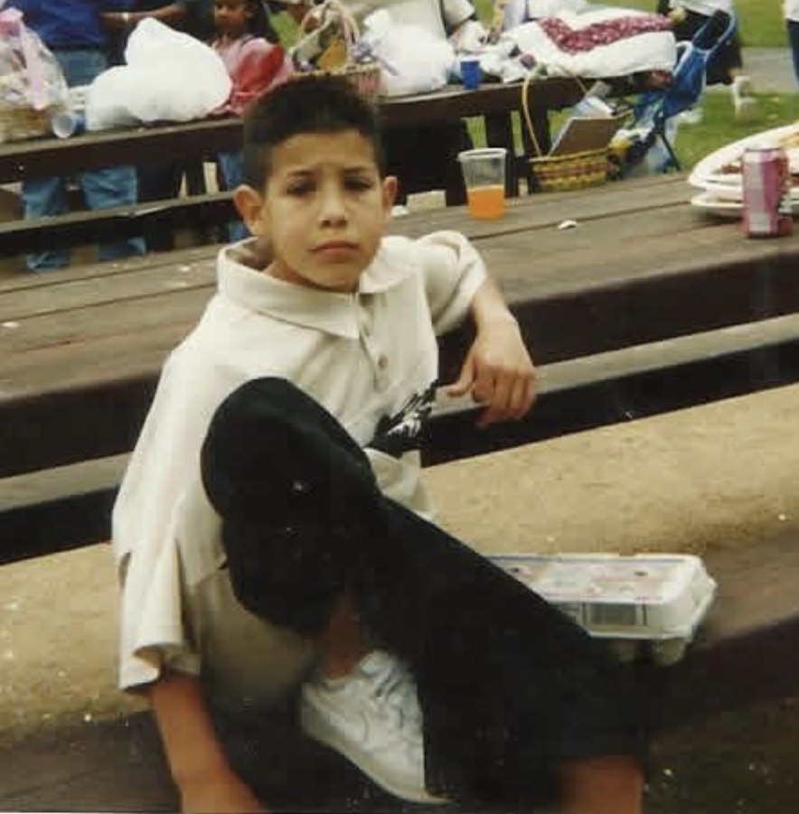 Bear as a youth at the park with skateboard