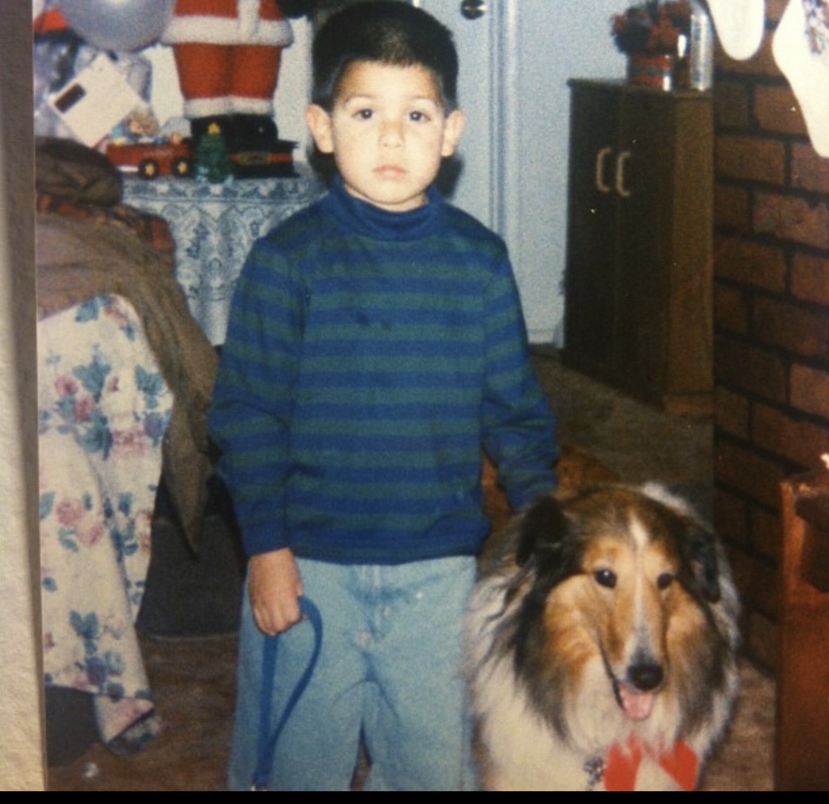 Bear as a boy with family collie at Christmas